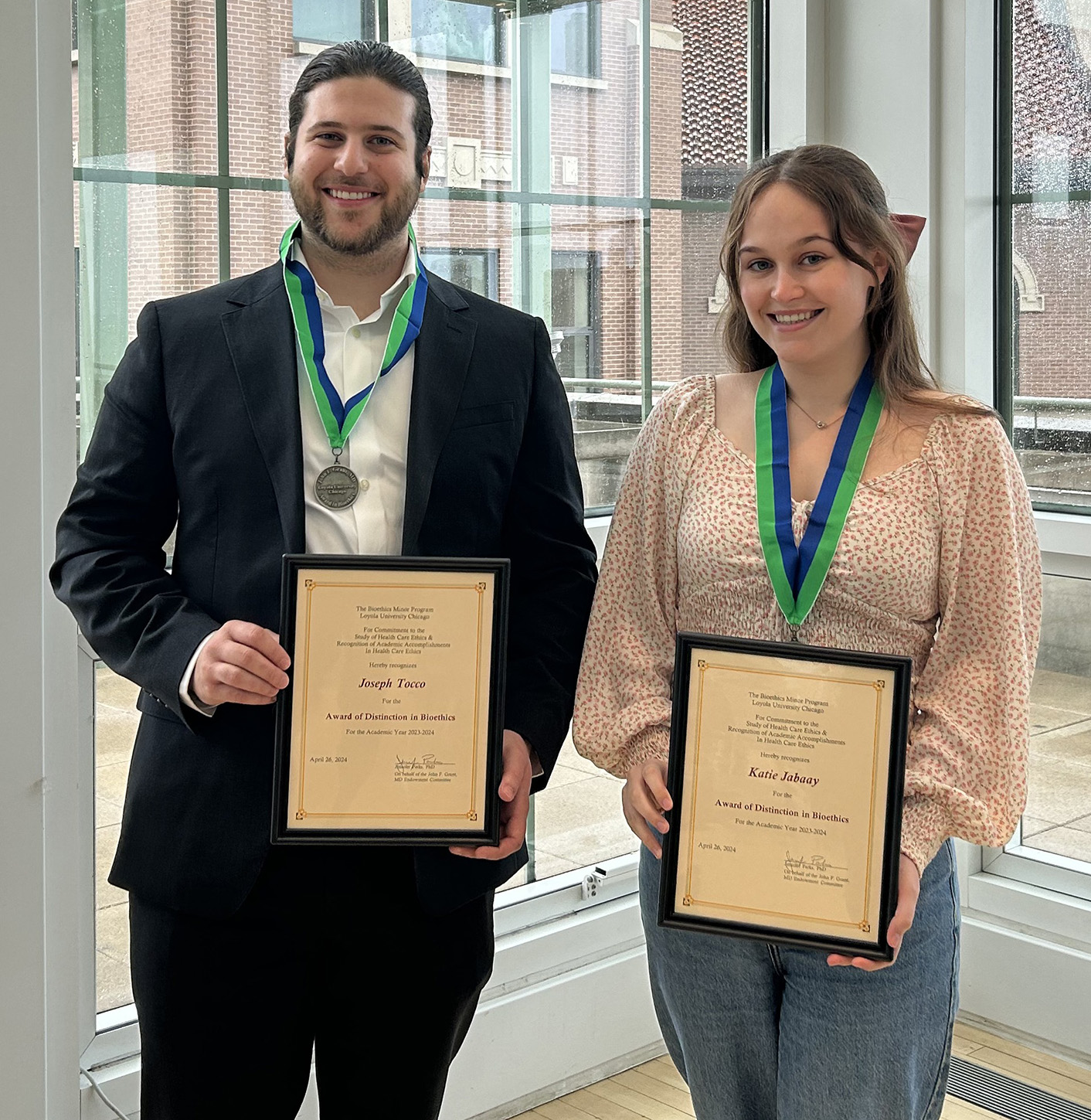 Distinction in Bioethics award winners pose with their certificates